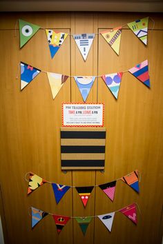 a bulletin board decorated with colorful pennants