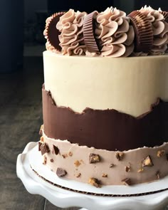 there is a cake with chocolate and cream frosting on it