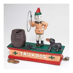 a figurine with a trick dog on top of it