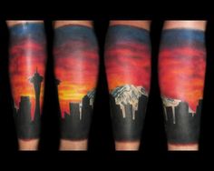 some tattoos on the legs of people with mountains and clouds in the background at sunset