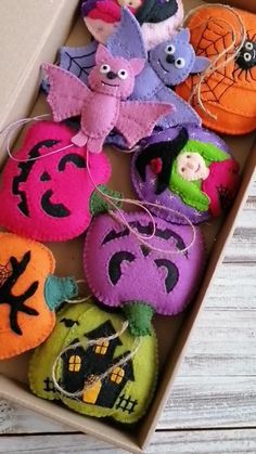 a box filled with halloween decorations on top of a wooden table