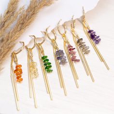 Raw Crystal Bar Drop Hoops, Colorful Birthstone Earrings Gift Daughter or Friend, Beaded Tassel Dangle Huggie Hoops, Long Bar Charm Huggies ✨ These earrings feature a beaded bar of genuine raw crystals & a 2-bar charm hanging from a dainty huggie hoop. Available in Gold finish. ✨ The simplicity of these earrings make them ideal gifts. They are lightweight and easy to match with your wedding color palette! Understated yet elegant, they can be paired with virtually any style of dress. PLEASE NOTE: These earrings are sold as SINGLES (1 Hoop total) or as PAIRS (2 Hoops total) --> Stacking Charm Hoops Available to Purchase HERE: https://www.etsy.com/listing/1522629950/ H O W ∙ T O ∙ O R D E R 1st DROP DOWN menu: * Select the GEMSTONE OPTION you would like 2nd DROP DOWN menu: * Select if you wou Bridesmaids Earrings, Quilling Work, Raw Crystals, Earrings Diy, Birthstone Earrings, Small Charms, Long Dangle Earrings, Birthstone Gifts, Birthstone Earring