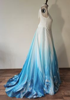 a dress on a mannequin with blue and white ombreached fabric