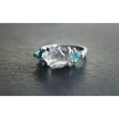 A Completely Raw California Diamond Set In Solid Sterling Silver And Accompanied By Two Raw Apatite Stones. Main Stone: California; Lake County Diamond Side Stones: Apatite Band: Sterling Silver Ring Size: 6.5 Can Be Resized Up To 6.75 Stone Measurements: 4x3mm 11x7mm 4x4mm California - Lake County Diamonds: Quartz Science Has Its Own Explanation For These Wonders Of Nature. Lake County Has Been The Scene Of Incredible Volcanic Activity Throughout Its Ancient Past. Mount Konocti, The Area's Defi Raw Crystal Ring By Angeline, Raw Crystals Ring, Crystal Wedding Ring Raw Vintage, Engagement Ring Raw Crystal, Raw Stone Engagement Rings Black, Raw Gem Stone Ring, Raw Stone Diamond Engagement Rings, Raw Cut Engagement Ring Unique, Raw Engagement Rings Rough Cut