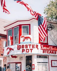 a red and white building with american flags on it