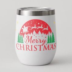 a white wine tumbler with merry christmas written on the side and santa's sleigh