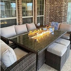 a fire pit sitting on top of a glass table