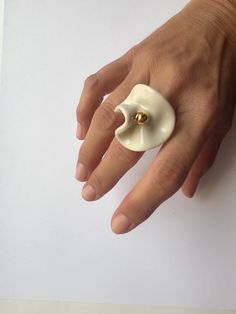 This porcelain ring with 24k gold is made out of porcelain and fired in special ceramic kiln three times on high temperature of 1220oC (2228oF). That high temperature made this ring very strong, but the ring is still fragile.  It's recommended to wear this ring just in special moments in your life, gold can fade by frequent friction and wetting. If you handle with care, the ring will last forever. If you are not sure about your ring size, please compare your ring with a picture of the porcelain Clay Embellishments, Porcelain Ring, Ceramic Kiln, Ceramic Rings, Nail Jewelry, Special Moments, White Flower, Serbia, Rings Statement