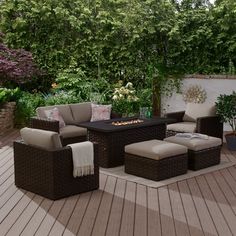 an outdoor patio with furniture and plants