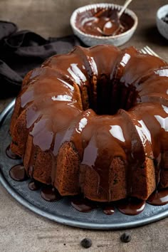 a bundt cake with chocolate icing on a plate