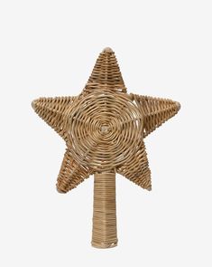 a wicker star decoration on a white background