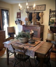 a dining room table and chairs with a christmas tree in the bowl on top of it