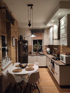 a kitchen with a table and chairs in it