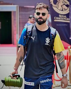 a man walking down the street with a backpack