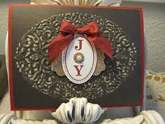 a close up of a card with a bow on it's head and the word joy