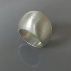 Sterling silver geometric ring, Sculptural ring, Silver statement ring, Chunky silver ring, Bold sil Modern Silver Wide Band Dome Ring, Modern Silver Dome Ring With Wide Band, Modern Silver Jewelry With Wide Band, Modern Silver Wide Band Jewelry, Modern Silver Wide Band Ring For Anniversary, Minimalist Silver Ring With Concave Shape, Modern White Gold Wide Band Ring As Gift, Modern Sterling Silver Dome Promise Ring, Modern White Gold Wide Band Ring For Gift