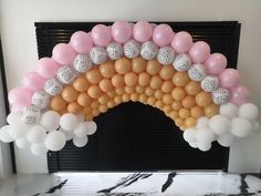 an arch made out of balloons and balls