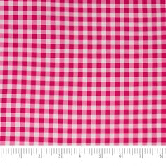 a pink and white checkered fabric with a ruler in front of the bottom half