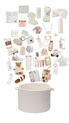 an assortment of baby items are arranged in the shape of a basket