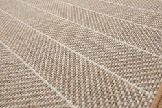 a close up view of a carpet with white lines on the top and bottom of it