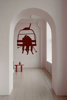 an image of a ski lift with two people on it in the middle of a hallway