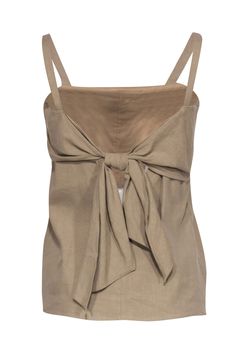 This fresh and modern top by Theory is a must have for your summer wardrobe! The darling bow tie back adds a charming element to the simple silhouette. Pop this breezy linen top on with a pair of jeans and a pair of sneakers for a casual ensemble. Size S Shell: 55% Linen, 41% Lyocell, 4% Elastane Lining: 100% Cotton Bow tie back closure Fully lined Flare silhouette Sleeveless Bust 32" Waist 34" Shoulder to hem 23" French Girl Chic, Indian Wedding Outfit, Modern Tops, Open Back Tank, Simple Silhouette, Chic Shop, Buy Shoes Online, French Girl, Linen Top