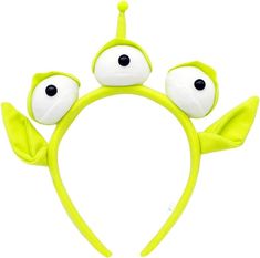 a green headband with eyes and leaves on it