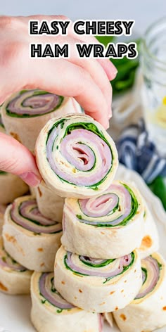 Ham wraps sliced on a plate with a closeup of one being held to the camera. High Roller Sandwiches, Lunchmeat Roll Ups, Deli Meat Roll Ups, Lunch Meat Roll Ups, Sandwich Roll Ups, Community Fridge, Roll Up Sandwiches, Travel Meals, Healthy Ham