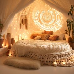 a bed with lights on the headboard and pillows in front of it, surrounded by plants