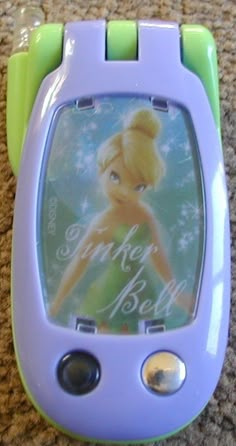 a toy cell phone with a tinkerbell photo on it