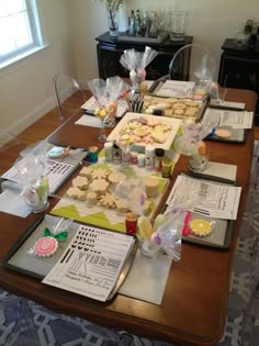 there are many cookies on the table ready to be cut and put into their packages