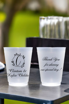 Clear frosted plastic wedding cups personalized with geomitric wreath monogram initial 'C' and custom text on front side and 3 lines of text on back side in black print Plastic Cups For Wedding, Reception Drink Station, Hay Wedding, Cups For Wedding, Wedding Drinks Reception, Wedding Cups Personalized, Wedding Plastic Cups, Bar Wedding Reception, Cup Favors Wedding