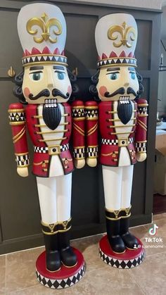 two nutcrackers are standing next to each other