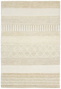 a beige and white rug with lines on the bottom, in different sizes and colors