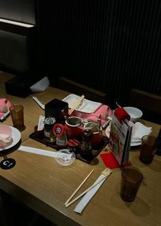 a table topped with lots of food and utensils