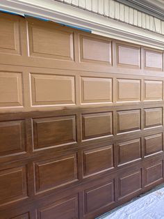 a brown garage door that has been painted