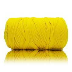 yellow yarn on white background with reflection stock photo - 1307982, shutterstocker