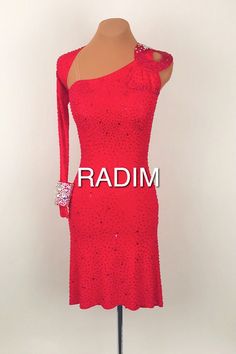 a red dress on a mannequin with the word radin written in white