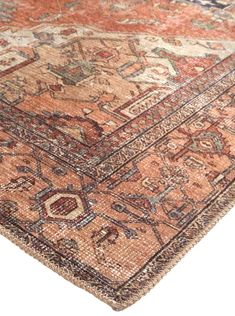 an antique rug with many different colors and patterns