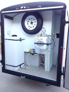 the inside of a trailer with an air conditioner and water heater in it