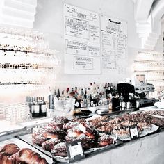 a bakery counter filled with lots of pastries