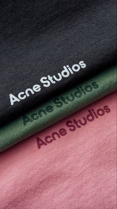 three t - shirts with the words acne studios on them in green, pink and black