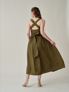 "Summer calls for a crisp dress and this cross-back dress from Linennaive is pretty perfect.  Made from breezy linen, it has comfortable cross back that'll really let skin breathe. Featuring a a classic square neckline and pleated detailing, evoking the laidback rhythms of far-off islands and unexplored landscapes.  It enhance the grace and femininity with a whimsical and flattering flow.  PS: It show very gorgeous and rich colors in sunlight for a truly one-of-a-kind, sophisticated allure. 【Fabric】 100% Linen, around 200g/gram. Medium weight. Every year we have a dedicated team to study the evolution of linen. Linen is a traditional fabric. It seems that linen will not change even if dynasties have changed, and time has passed. Let us add a little imagination and curiosity here. If the ra Knee-length Midi Dress With Tie Back For Garden Party, Knee-length Tie Back Midi Dress For Garden Party, Brunch Dresses With Tie And Cross Back, Summer Sundress With Cross-back Design, Summer Sundress With Cross Back, Green Midi Dress For Picnic, Chic Summer Midi Dress With Cross Back, Chic Tie Back Dress For Picnic, Chic Tie-back Dress For Picnic