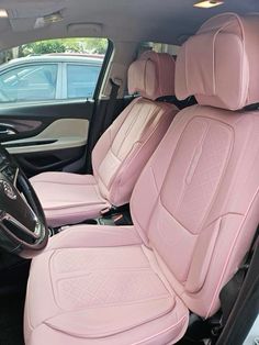 the interior of a car with pink leather seats