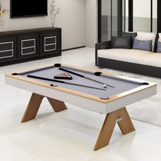 a pool table in the middle of a living room