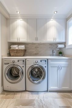 a washer and dryer in a white laundry room