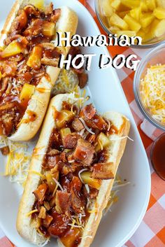 two hot dogs with toppings on a plate