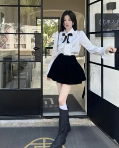 Complete your Dark Academia look with this swoon-worthy set (pieces also available separately)! This two-piece combo of a black sultry velvet mini skirt and a white academia shirt with ruffled front accent and a black ribbon rosette pin, is sure to make you the talk of the school! Stand out from the crowd and show off your unique academia style in these stylish pieces from Deer Doll.! Skirt size S Waist: 64-66cm Hips: 104cm Length: 37cm; Skirt M Waist: 68-70cm Hips: 108cm Length: 38cm; Skirt L W Skirt With Button Up Shirt Outfit, Fav Aesthetic Outfit, Button Up And Skirt Outfit, White Shirt And Skirt Outfit, Black Skirt White Shirt Outfit, Doll Style Outfits, School Uniforms Aesthetic, Korean Outfits Skirts, Outfits With Black Skirt