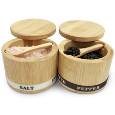 salt and pepper in wooden containers on white background