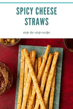 spicy cheese straws on a plate with olives in the background and text overlay that says spicy cheese straws